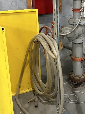 Second fire hose station mounted on an interior wall